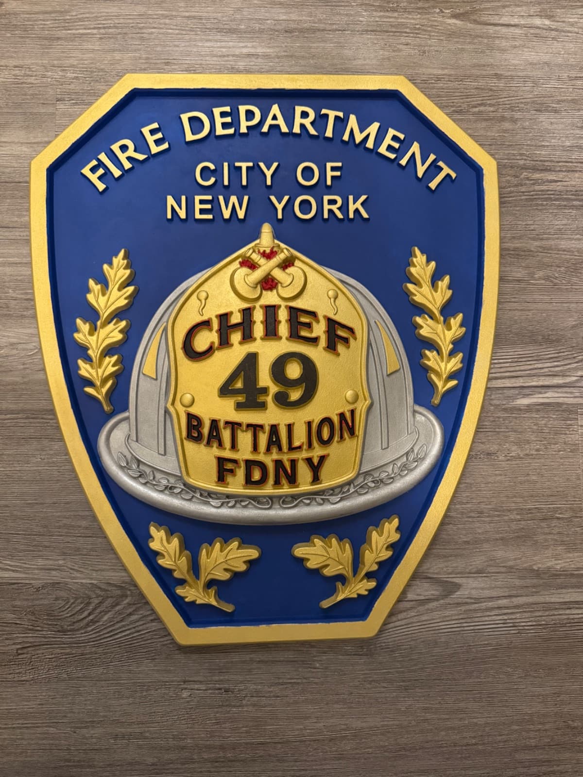 A handcrafted hardwood badge from the Serenity Woodworks collection